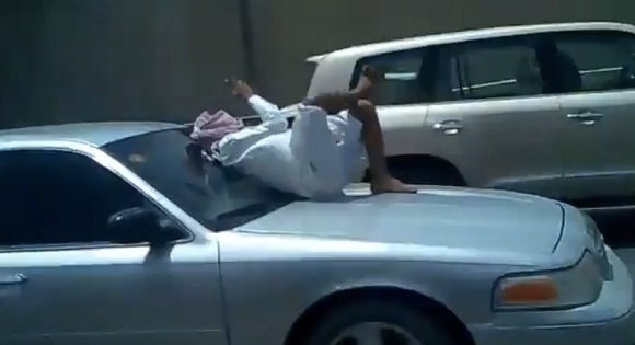 Saudi Man texts on bonnet Speeding car Insurance must be expensiveth_